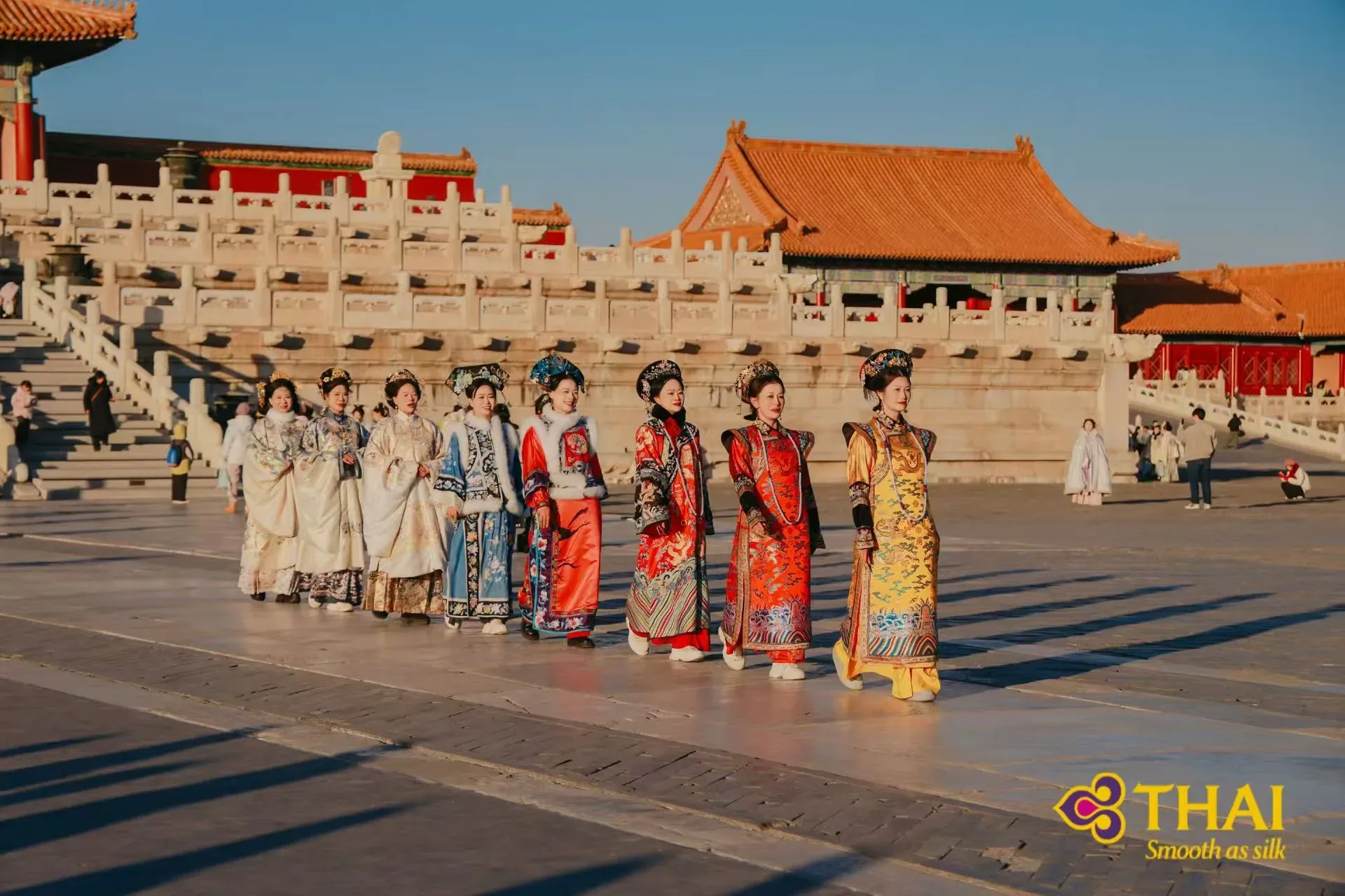 Travel service team in imperial costumes at a Chinese heritage site