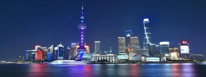 Shanghai skyline at night along the Huangpu River
