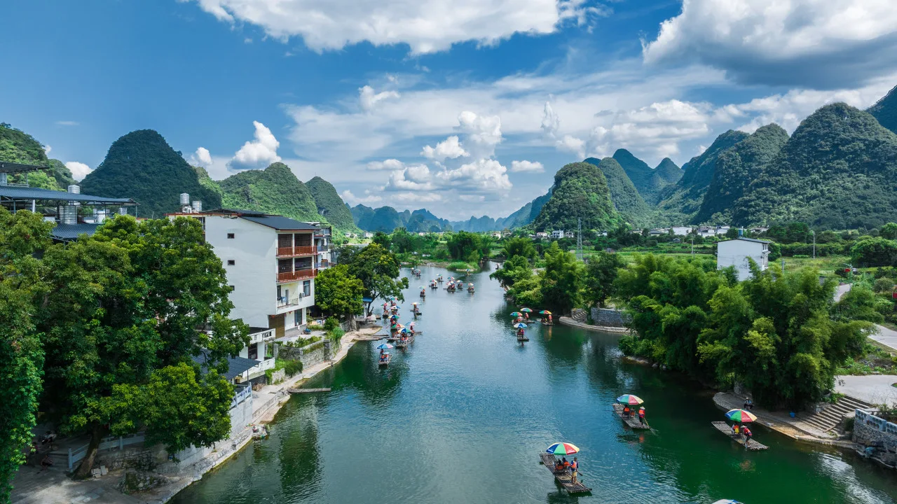 Li River cruising scene with karst mountains and small boats